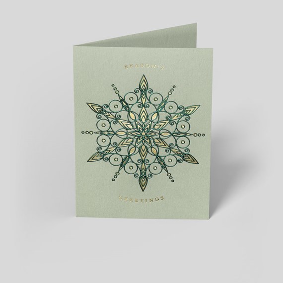 folded card with mandala design and text